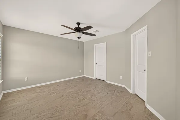 a view of an empty room with a window