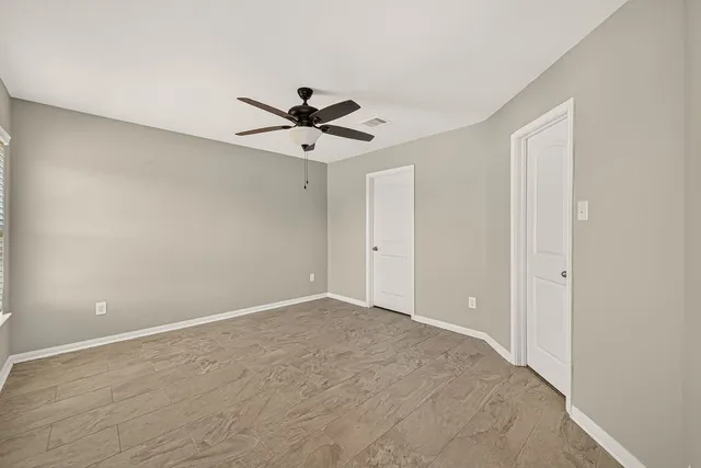 a view of an empty room with a window