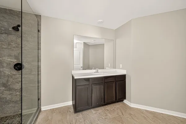 a bathroom with a sink and mirror