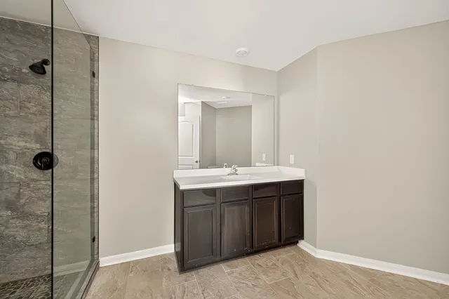 a bathroom with a sink and mirror