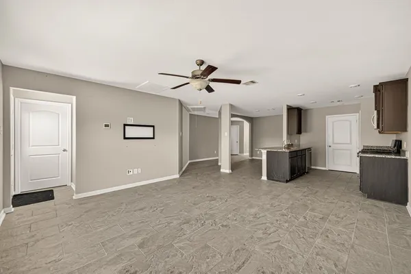 a view of a livingroom with a kitchen
