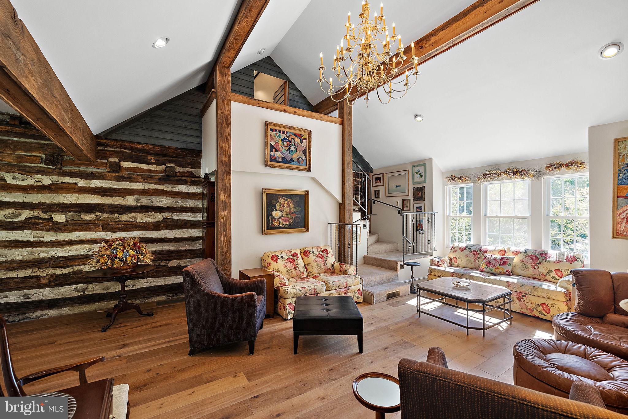 126 Ridge Road Chadds Ford, PA 19317 - Photo 13 of 64 a living room with furniture and a chandelier