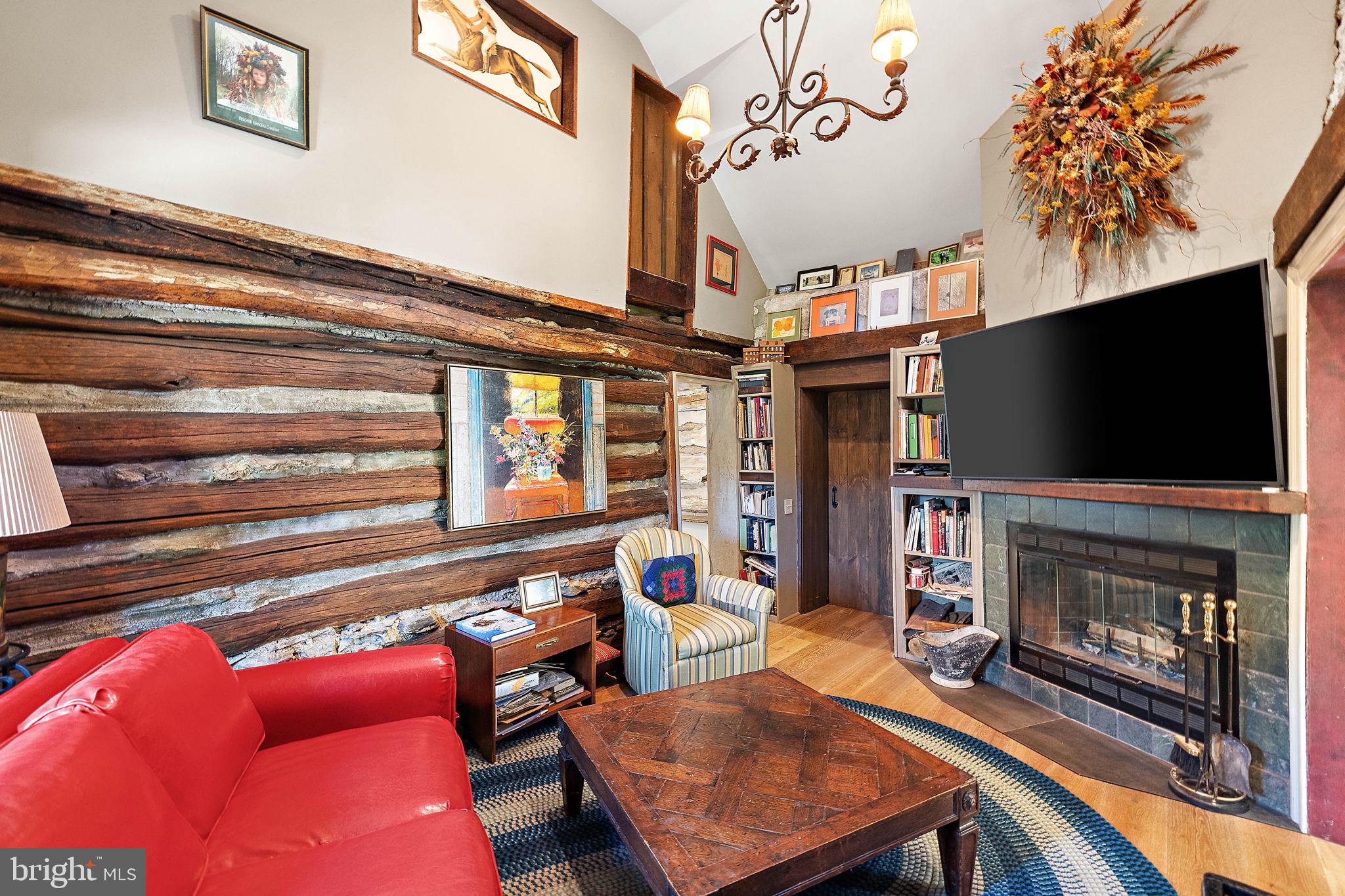 126 Ridge Road Chadds Ford, PA 19317 - Photo 30 of 64 a living room with furniture a flat screen tv and a fireplace