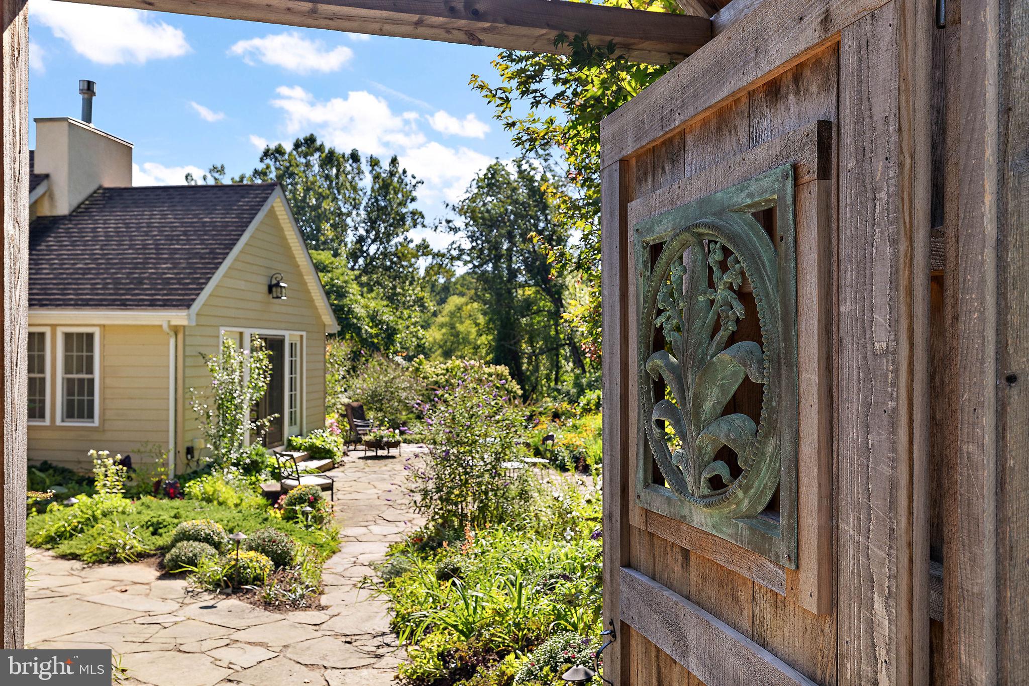 126 Ridge Road Chadds Ford, PA 19317 - Photo 4 of 64 a front view of a house with a yard