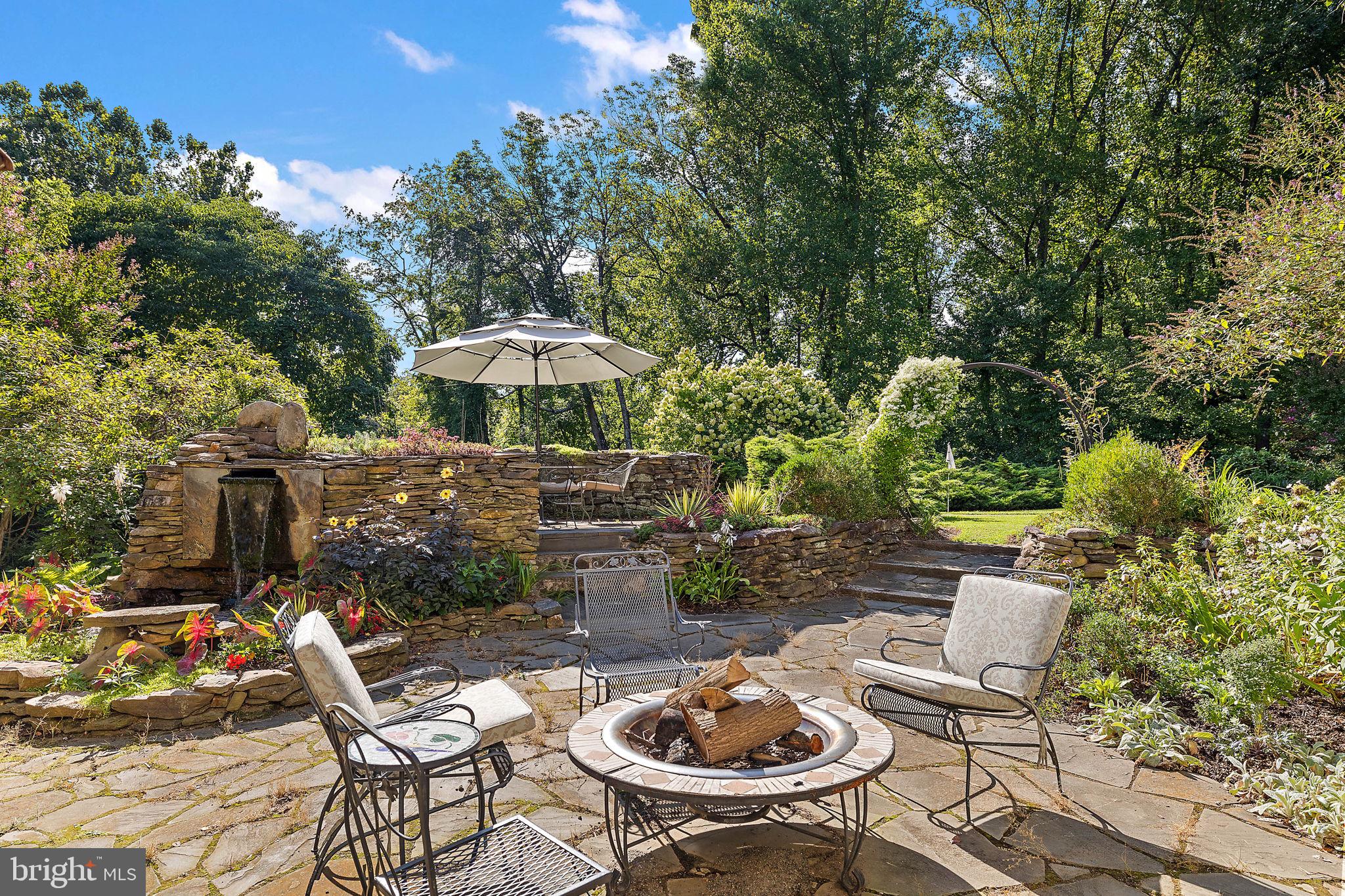 126 Ridge Road Chadds Ford, PA 19317 - Photo 57 of 64 a view of a chairs and table in backyard