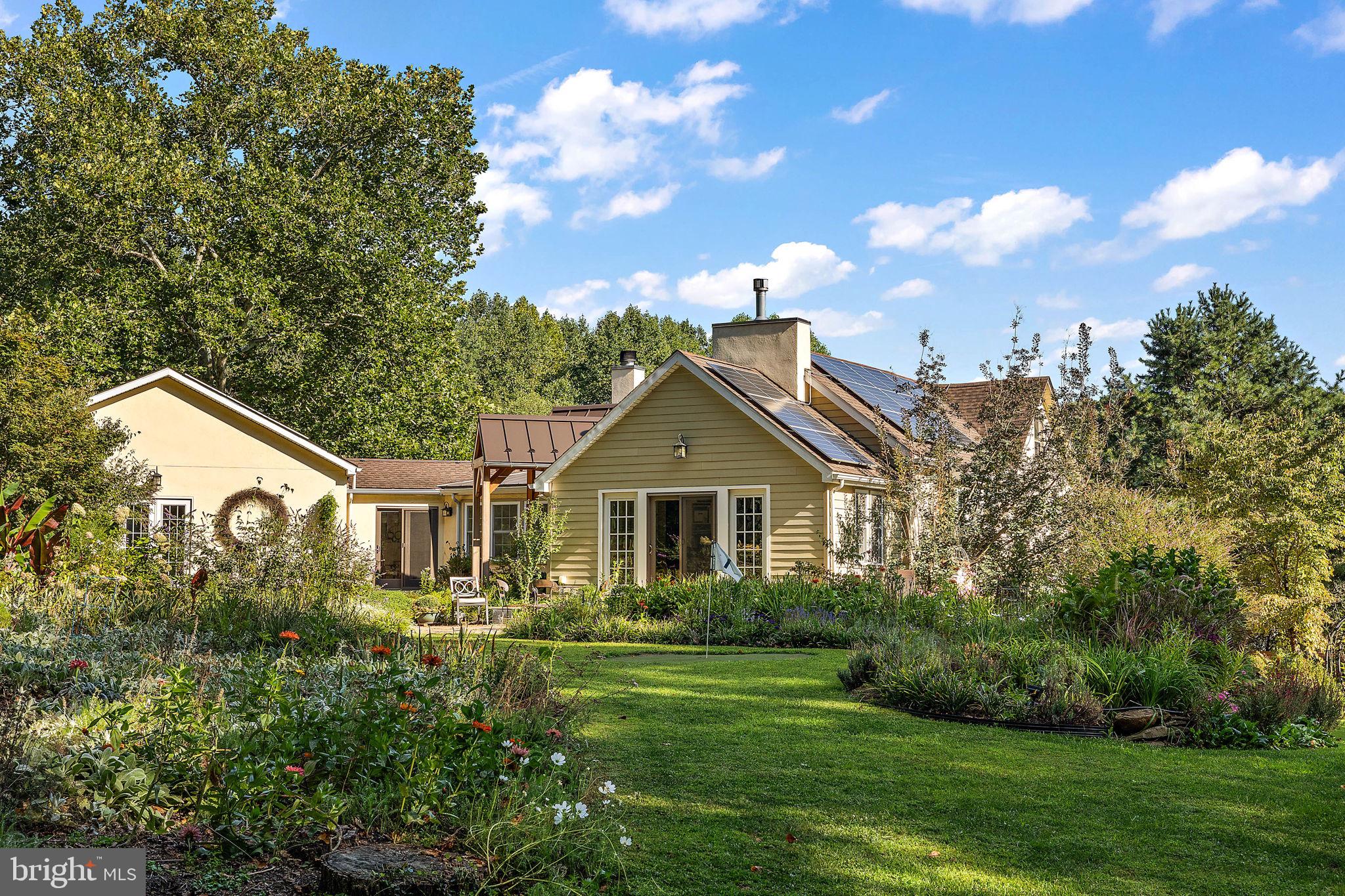 126 Ridge Road Chadds Ford, PA 19317 - Photo 64 of 64 a front view of a house with a yard