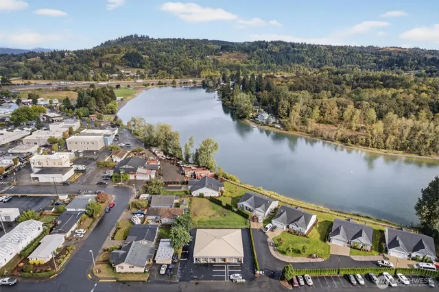 an aerial view of a city with lake view