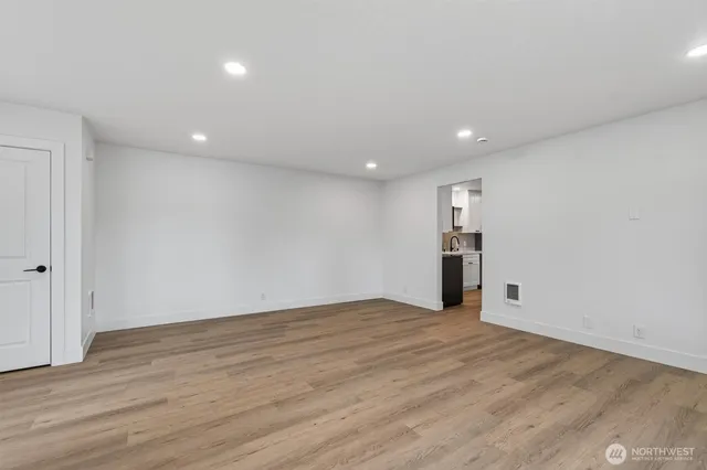 a kitchen with stainless steel appliances granite countertop a refrigerator and a stove top oven