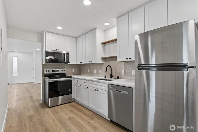 a kitchen with a stove and a microwave