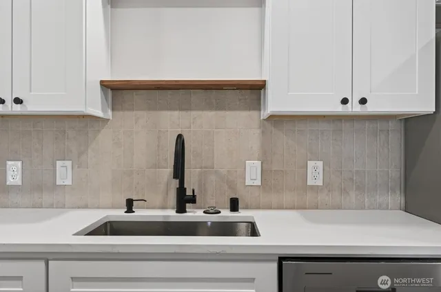a view of an empty room and wooden floor