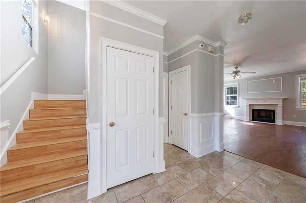 6790 Palace Lane Fairburn, GA 30213 - Photo 11 of 62 a view of a hallway with wooden floor and a fireplace