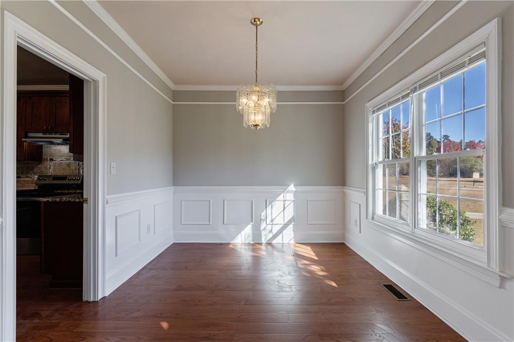 6790 Palace Lane Fairburn, GA 30213 - Photo 14 of 62 a view of a room with wooden floor and outdoor view