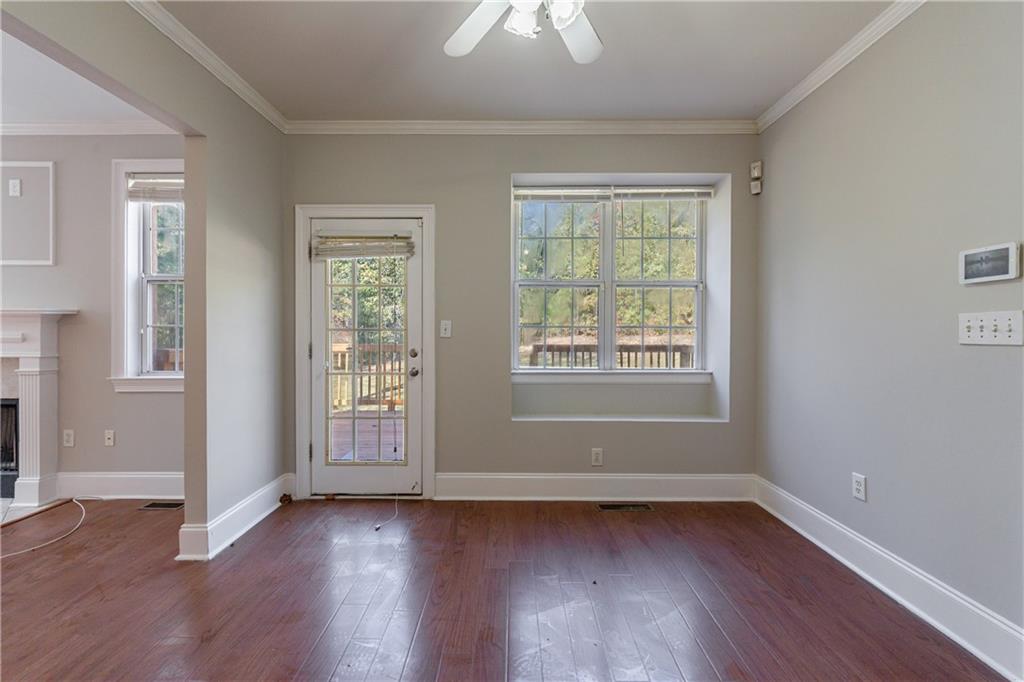 6790 Palace Lane Fairburn, GA 30213 - Photo 24 of 62 an empty room with wooden floor and windows