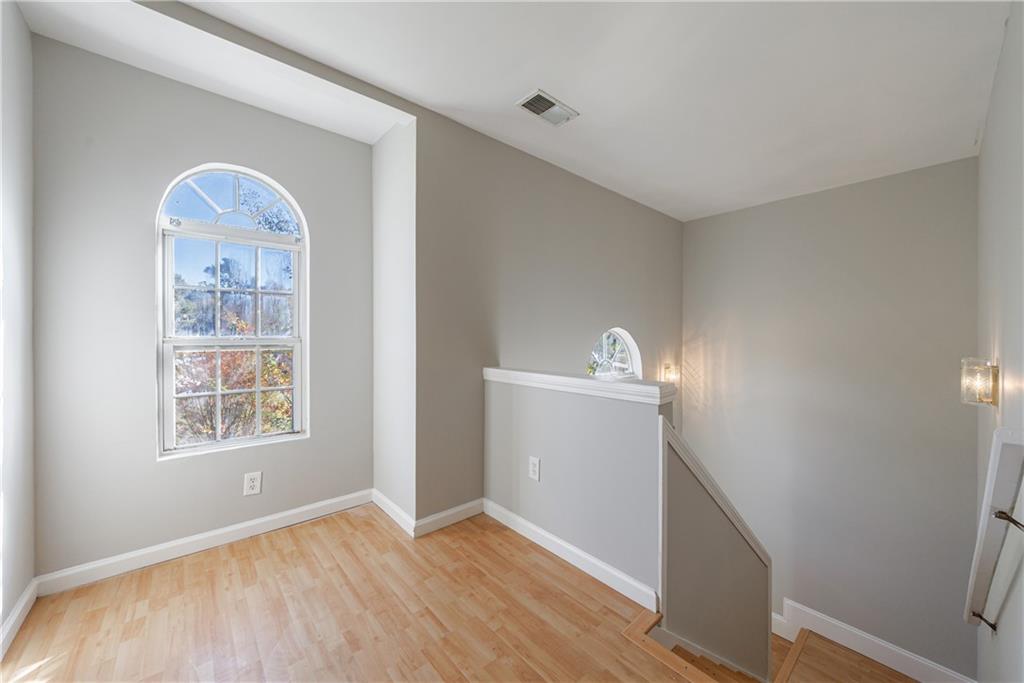 6790 Palace Lane Fairburn, GA 30213 - Photo 31 of 62 a view of a livingroom with wooden floor and a window
