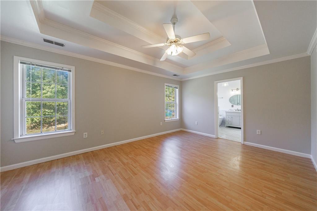 6790 Palace Lane Fairburn, GA 30213 - Photo 33 of 62 a view of an empty room with wooden floor and a window