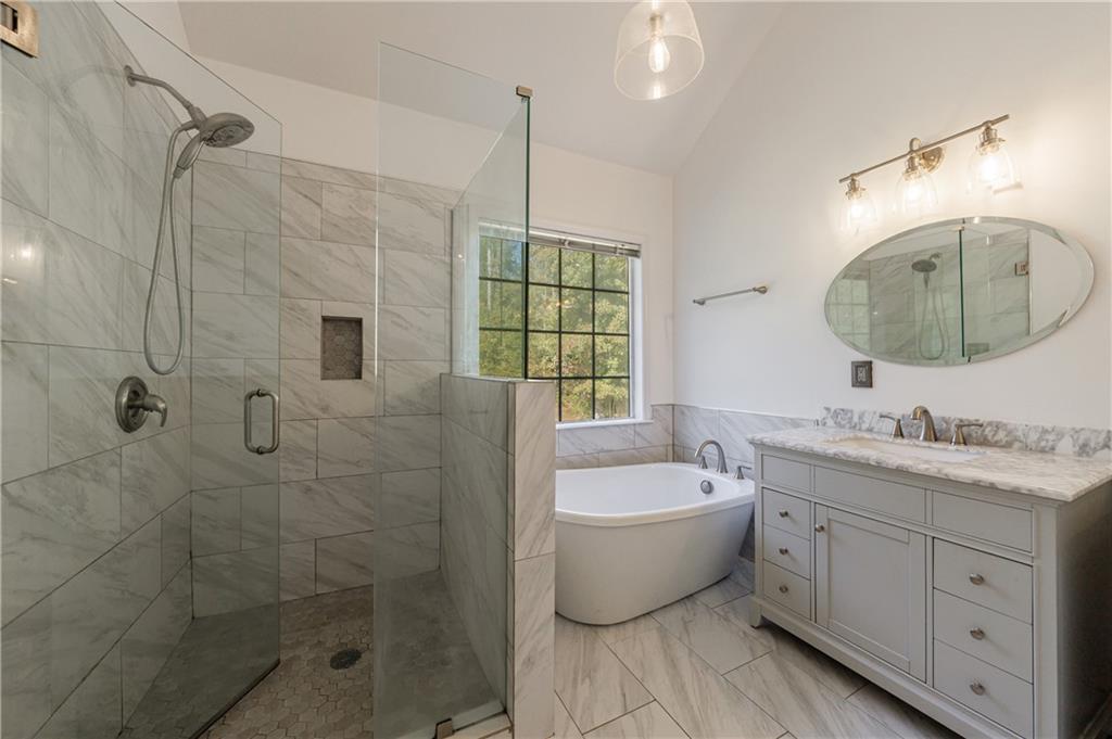 6790 Palace Lane Fairburn, GA 30213 - Photo 36 of 62 a bathroom with a double vanity sink mirror and bathtub