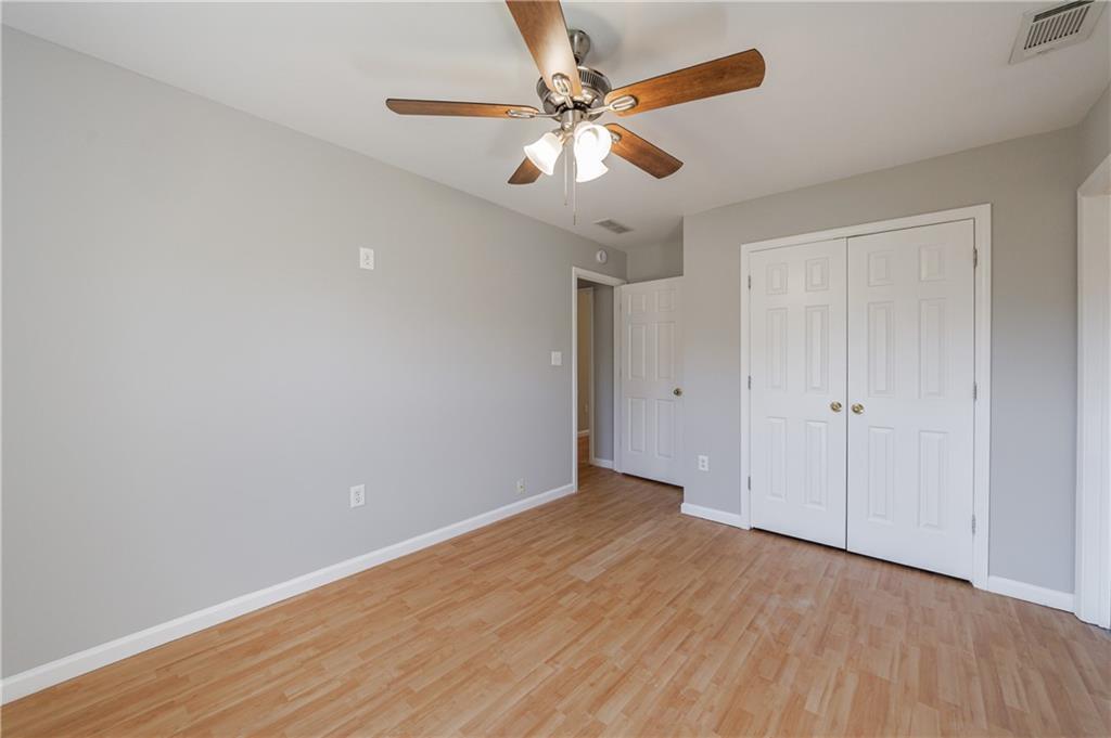 6790 Palace Lane Fairburn, GA 30213 - Photo 42 of 62 a view of an empty room with wooden floor