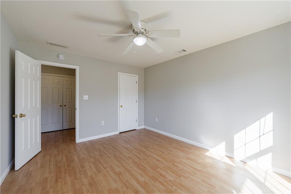 6790 Palace Lane Fairburn, GA 30213 - Photo 46 of 62 a view of an empty room with wooden floor