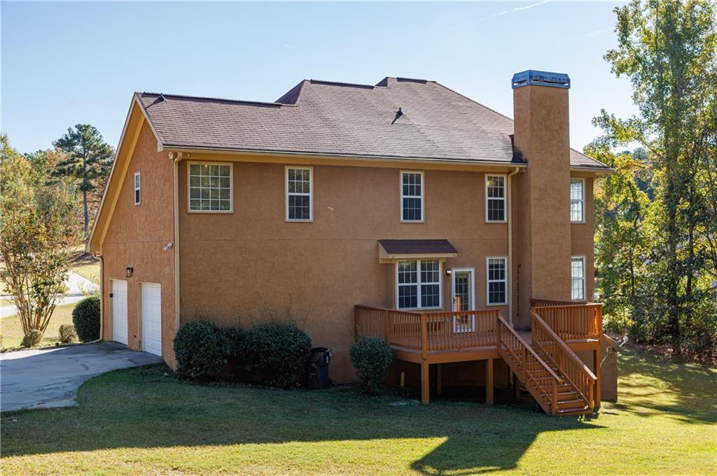 6790 Palace Lane Fairburn, GA 30213 - Photo 5 of 62 a front view of house with yard space and seating