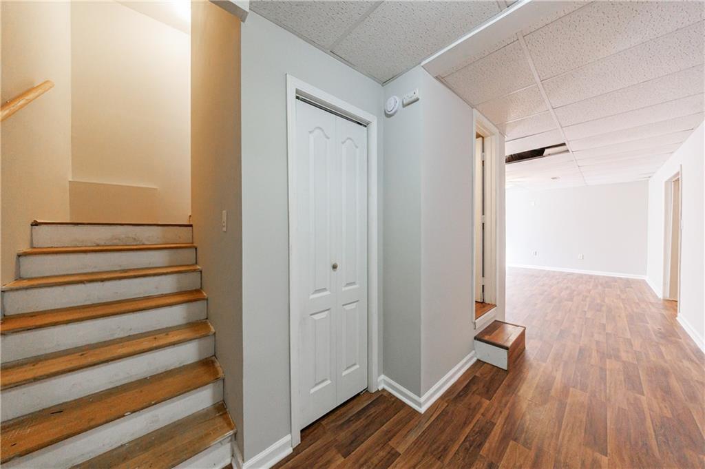 6790 Palace Lane Fairburn, GA 30213 - Photo 51 of 62 a view of a room with wooden floor and staircase