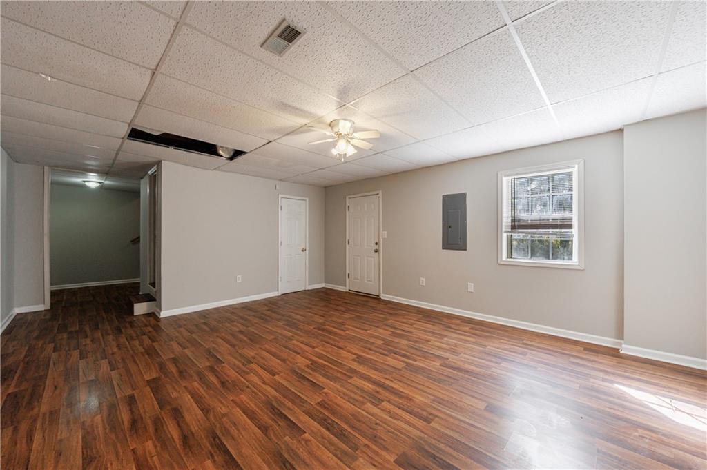 6790 Palace Lane Fairburn, GA 30213 - Photo 55 of 62 a view of an empty room with window and wooden floor