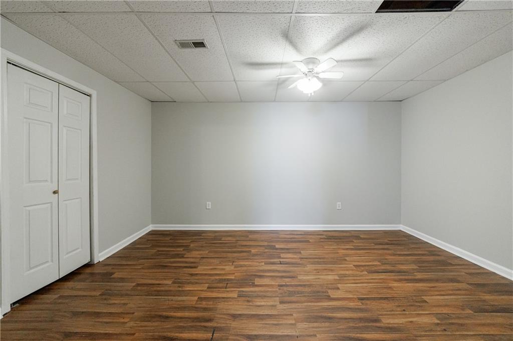 6790 Palace Lane Fairburn, GA 30213 - Photo 56 of 62 a view of an empty room with wooden floor