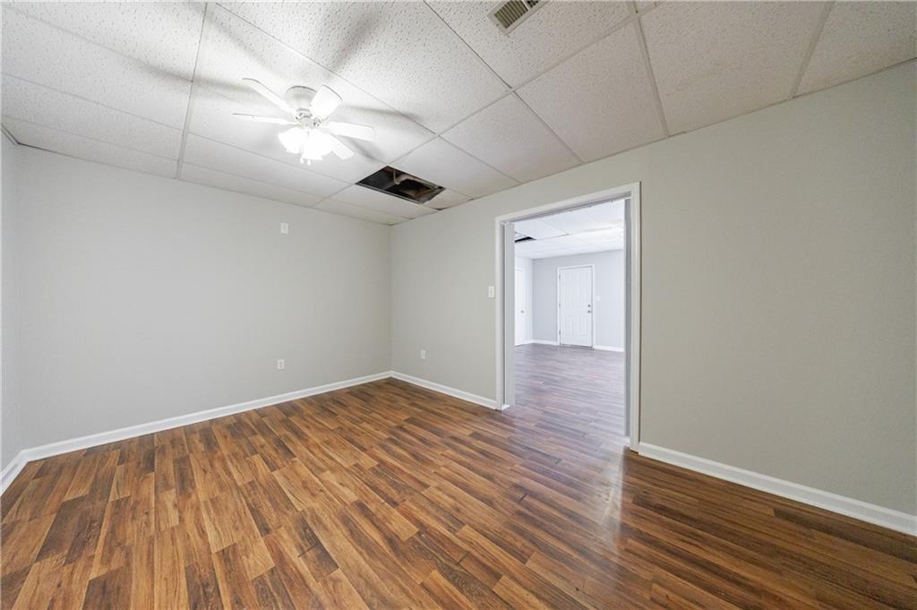 6790 Palace Lane Fairburn, GA 30213 - Photo 57 of 62 a view of an empty room with wooden floor