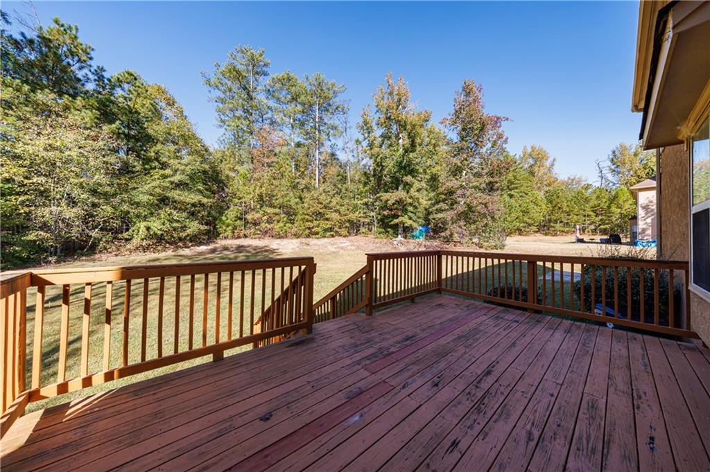 6790 Palace Lane Fairburn, GA 30213 - Photo 7 of 62 a view of balcony with wooden floor and fence