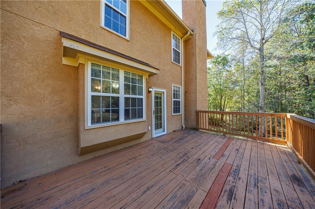 6790 Palace Lane Fairburn, GA 30213 - Photo 8 of 62 a view of front door deck and wooden floor