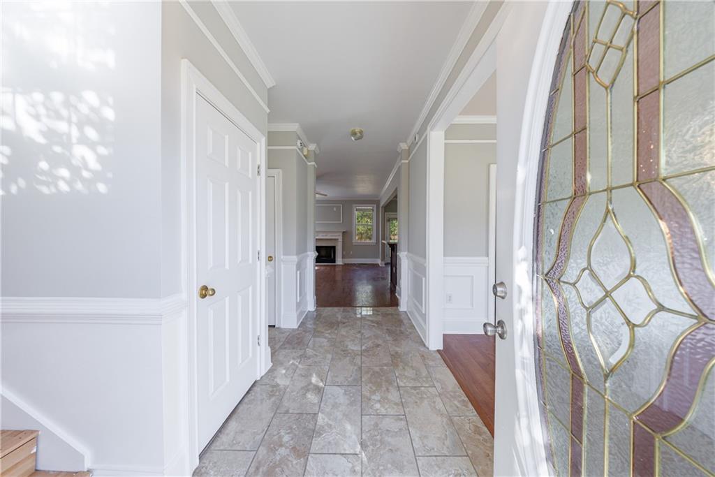 6790 Palace Lane Fairburn, GA 30213 - Photo 10 of 62 a view of a hallway with wooden floor and entryway