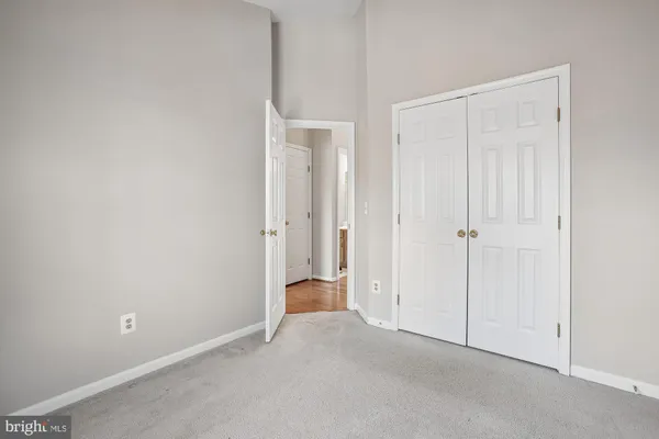 an empty room with closet area