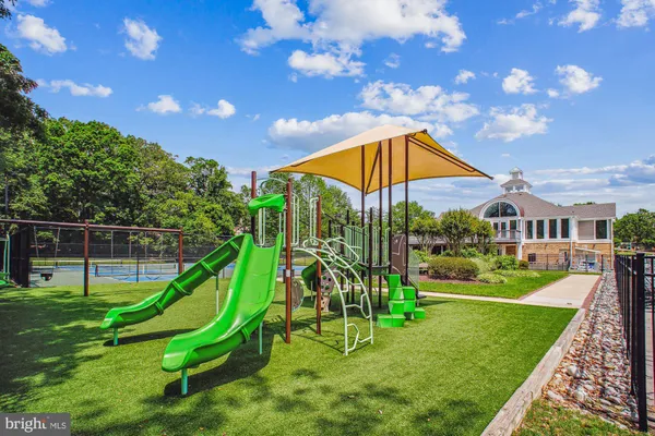 a view of a multi story building with a yard