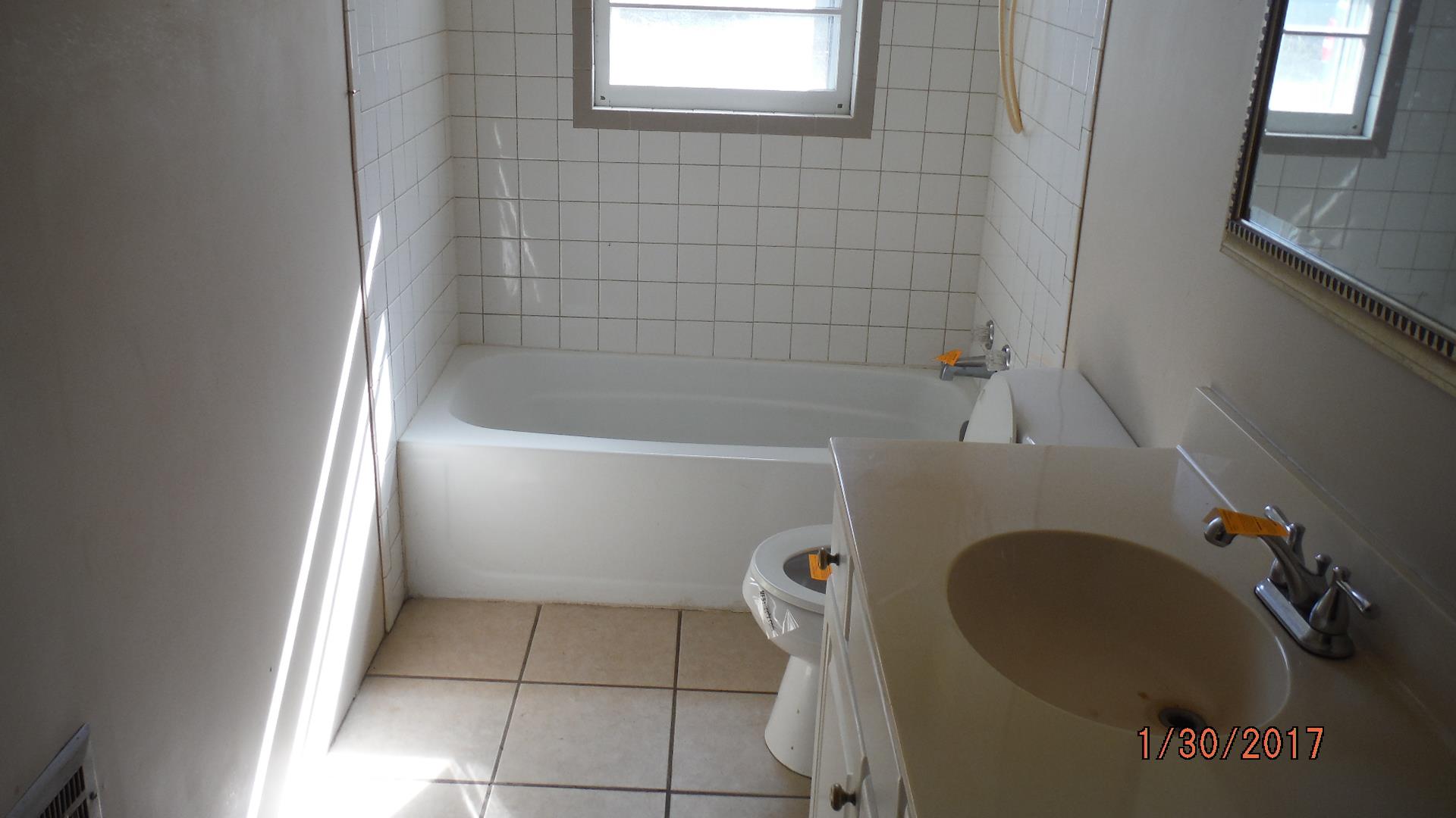 8852 Pinewood Road Lyles, TN 37098 - Photo 12 of 14 a bathroom with a bathtub
