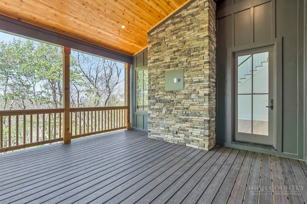 536 Boone Ridge Lane Boone, NC 28607 - Photo 11 of 50 an empty room with wooden floor and windows
