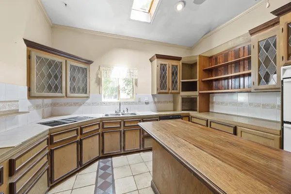 a kitchen with a sink and a window