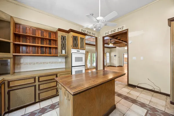 a view of kitchen with cabinets and wooden floor