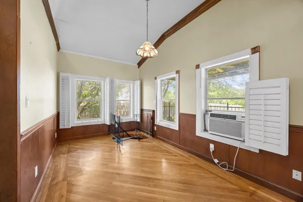 a view of a livingroom with furniture hardwood floor and a ceiling fan