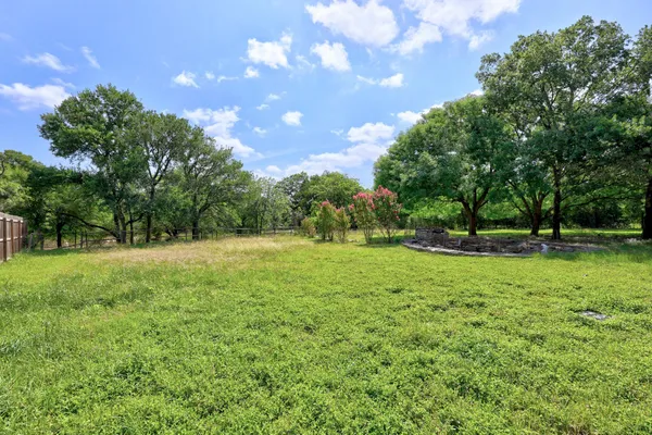 a view of backyard with green space
