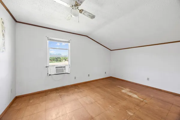a view of a big room with windows and cabinet