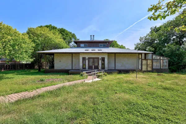 front view of a house with a garden