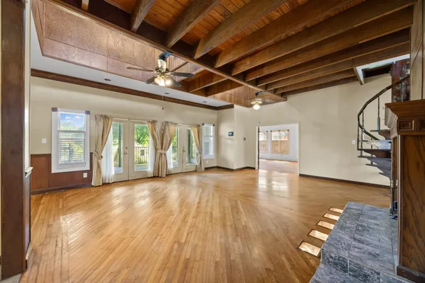 a view of hallway with wooden floor