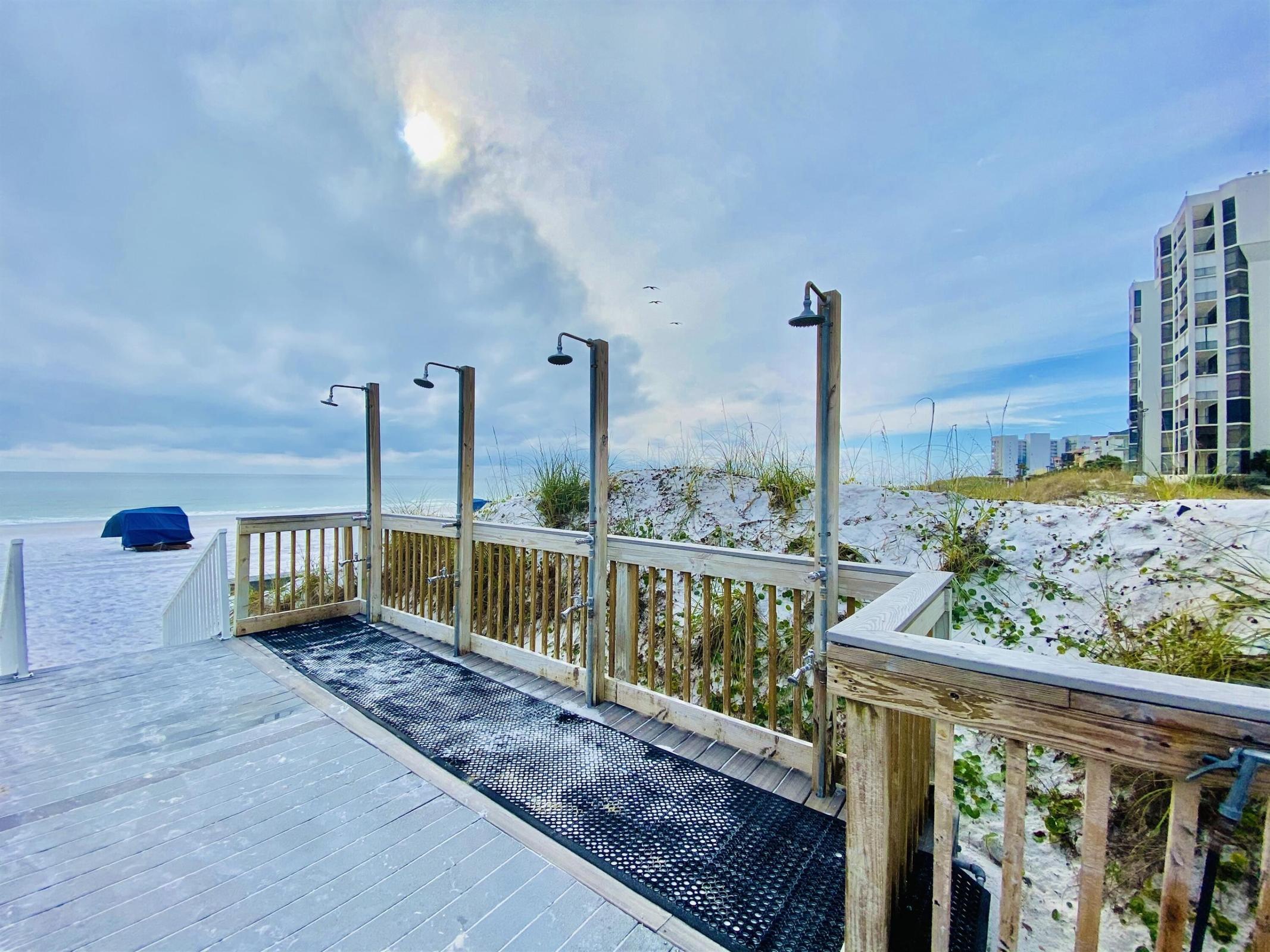 970 Highway 98, Unit 303 Destin, FL 32541 - Photo 27 of 42 a view of a balcony with wooden fence