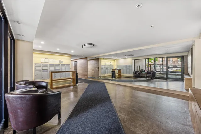 a dining hall with stainless steel appliances granite countertop a stove and a sink