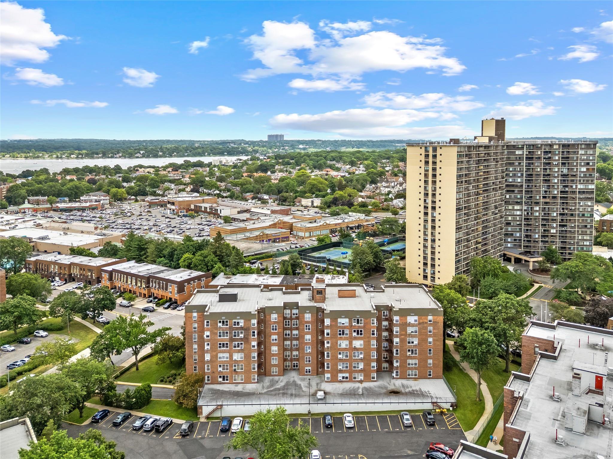 210-15 23rd Avenue, Unit 3B Queens, NY 11360 - Photo 18 of 18 a view of a city with tall buildings