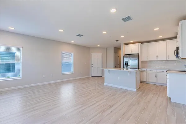 a bathroom with a sink double vanity and shower
