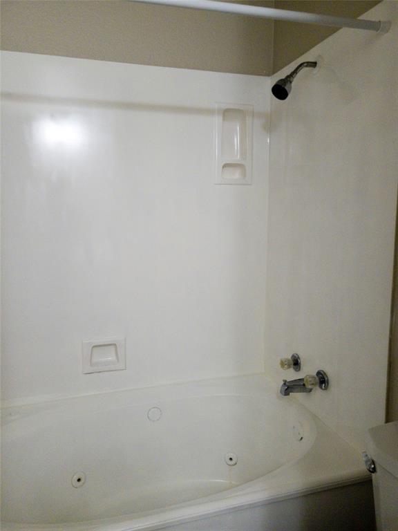 1501 Cedar Elm Drive, Unit 201 Euless, TX 76039 - Photo 17 of 23 a bathroom with a bathtub