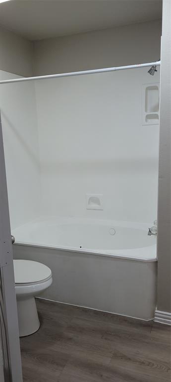 1501 Cedar Elm Drive, Unit 201 Euless, TX 76039 - Photo 21 of 23 a bathroom with a toilet and a shower