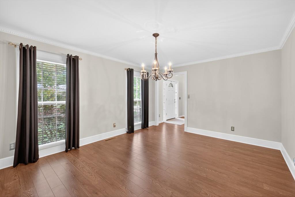 82 Cedar Bluff Winder, GA 30680 - Photo 21 of 47 a view of an empty room with wooden floor and a window