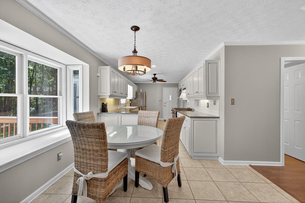 82 Cedar Bluff Winder, GA 30680 - Photo 22 of 47 a view of a dining room and livingroom with furniture wooden floor a chandelier