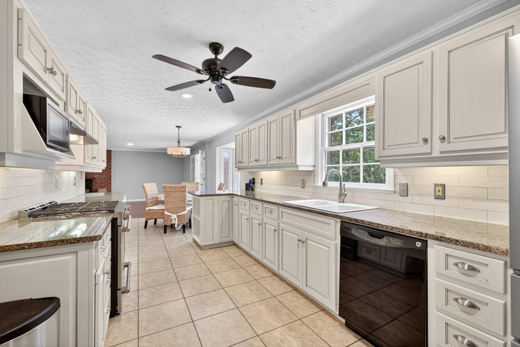 82 Cedar Bluff Winder, GA 30680 - Photo 24 of 47 a kitchen with a stove white cabinets and white appliances
